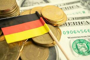 Stack of coins with USA Germany flag on white background. photo