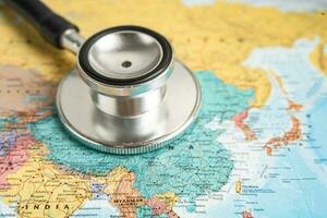 Bangkok, Thailand June 1, 2022, Stethoscope on China world globe map background. photo