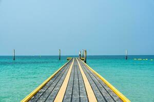 Pontoon walkway floating with pillar on tropical sea photo