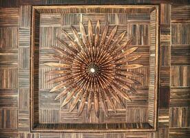Luxury ancient ceiling design with craft wooden timber and light bulb in hall of church photo