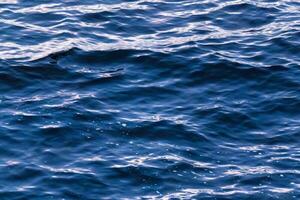 Rippled blue sea water surface photo