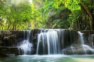 Waterfall deep forest scenic natural sunlight photo