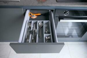 cutlery fork with knife and spoon in a drawer photo
