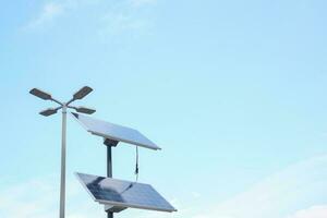 Solar pannels on street against blue sky photo