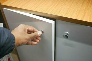 top view of men hand open a a drawer photo