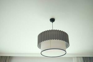 gray ceiling lamp hanging in a room , photo