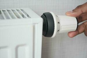 heating radiator against white wall photo