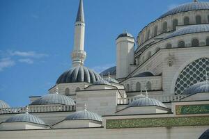 a beautiful mosque against blue sky photo