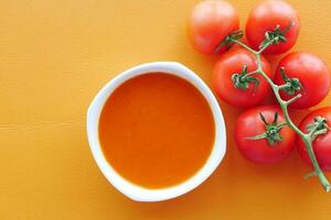 fresh tomato soup on table photo