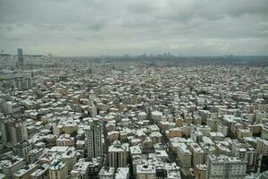 top view of Snowfall on buildings in istanbul city photo