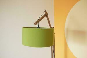 a lamp in home against white wall photo