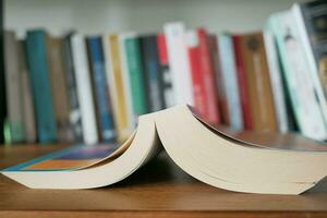 stack of books on wooden table photo