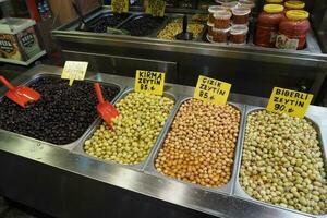 Buckets of olives for sale street food market photo