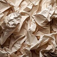 Abstract beige, pastel background. Crumpled paper texture with many folds. photo