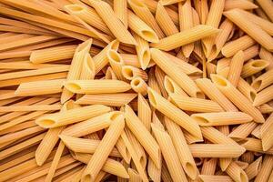 Detail of Italian pasta mix spaghetti and penne photo