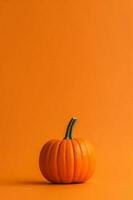 A photo of an minimalist orange Pumpking background with copy space. AI generative