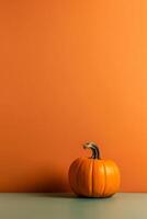 A photo of an minimalist orange Pumpking background with copy space. AI generative