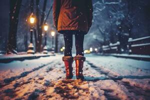 Back view of close up of a woman leg walking in snowy winter night park. AI generative photo