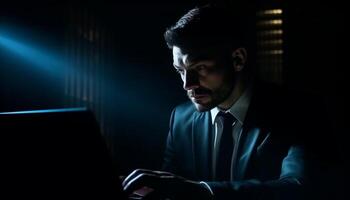 Confident businessman working on computer in dark office generated by AI photo