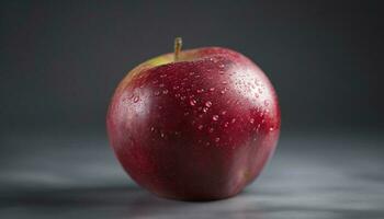 Juicy red apple reflects nature freshness in healthy gourmet snack generated by AI photo