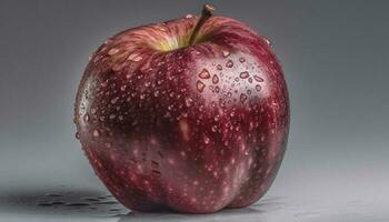 Juicy apple reflects nature freshness in vibrant studio shot generated by AI photo