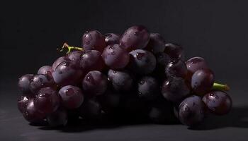 Juicy purple grape bunch on leafy plant, symbolizing organic agriculture generated by AI photo