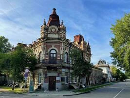 18 of July 2022 - Irkutsk, Russia. Dilapidated wooden house in a state of disrepair, still inhabited by people photo