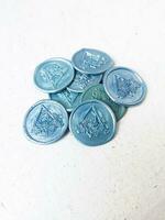 colorful wax coin made from wax sealing stamp for vintage look for letter or wedding invitation photo