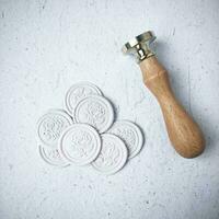 colorful wax coin made from wax sealing stamp for vintage look for letter or wedding invitation photo