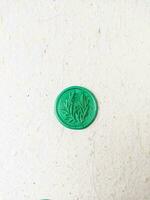 colorful wax coin made from wax sealing stamp for vintage look for letter or wedding invitation photo