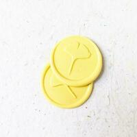 colorful wax coin made from wax sealing stamp for vintage look for letter or wedding invitation photo