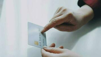 Businesswoman hands holding cradit card and using credit card online shopping. Online shopping concept video