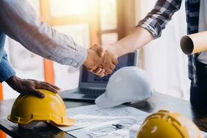 Architect having a meeting with construction team on site photo