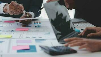 Close up of Business team analyzing income charts and graphs with modern laptop computer. Business analysis and strategy concept. video