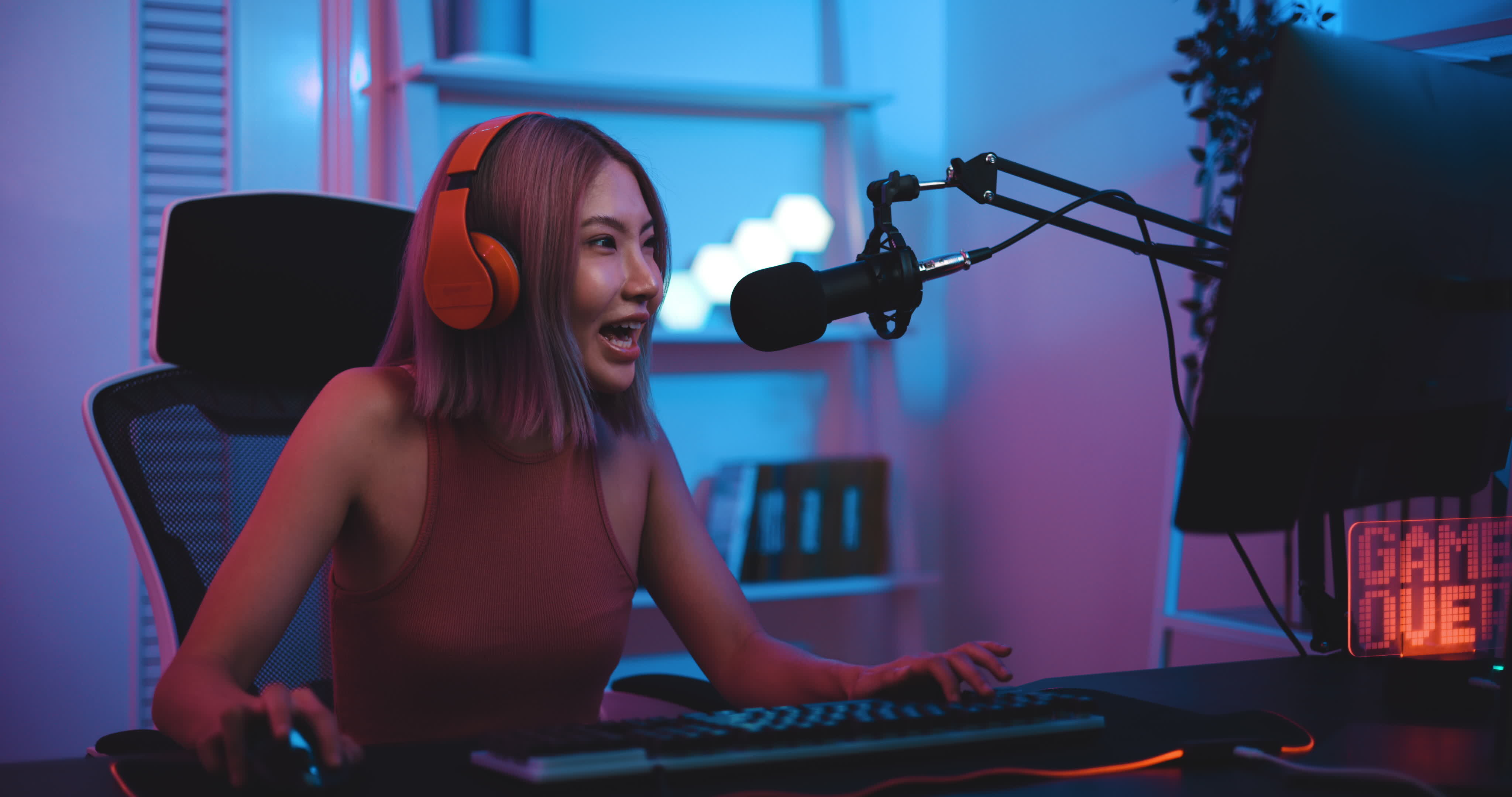 Pro Player Gamer Young Asian Woman Playing Online Video Game Shooting Fps  Tournament Ranking Cyber Internet At Night Red Neon Light Room With Gaming  Headset And Keyboard On Championship Event Stock Photo 