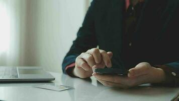 Women holding credit card and using smartphones at home.Online shopping, internet banking, store online, payment, spending money, e-commerce payment at the store, credit card, concept video