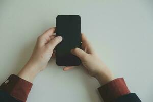 Woman hands holding and using cradit card for shopping online. photo