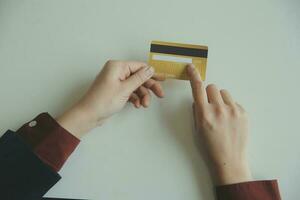 Woman hands holding and using cradit card for shopping online. photo