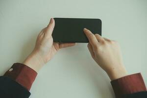 Woman hands holding and using cradit card for shopping online. photo