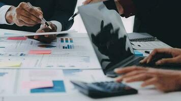 Financial analysts analyze business financial reports on a digital tablet planning investment project during a discussion at a meeting of corporate showing the results of their successful teamwork. video