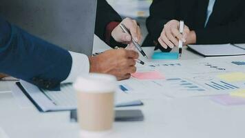 Financial analysts analyze business financial reports on a digital tablet planning investment project during a discussion at a meeting of corporate showing the results of their successful teamwork. video