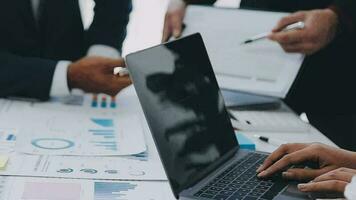 Financial analysts analyze business financial reports on a digital tablet planning investment project during a discussion at a meeting of corporate showing the results of their successful teamwork. video