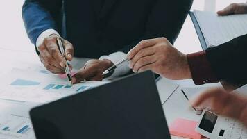 Financial analysts analyze business financial reports on a digital tablet planning investment project during a discussion at a meeting of corporate showing the results of their successful teamwork. video