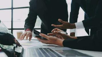 Financial analysts analyze business financial reports on a digital tablet planning investment project during a discussion at a meeting of corporate showing the results of their successful teamwork. video