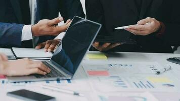 Financial analysts analyze business financial reports on a digital tablet planning investment project during a discussion at a meeting of corporate showing the results of their successful teamwork. video