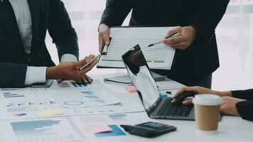 Financial analysts analyze business financial reports on a digital tablet planning investment project during a discussion at a meeting of corporate showing the results of their successful teamwork. video