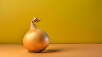 A single onion on a pastel yellow background. photo