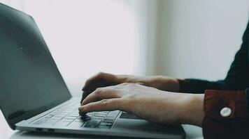 Portrait of Asian young female working on laptop at office video