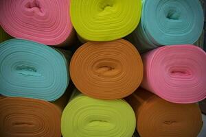 Artistic variety of shade tone colors Textile Fabrics rolls stacked pattern texture photo