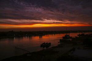 Sunset on the Shitalakshya River in Bangladesh. The Shitalakshya  River is a river in South Asia photo